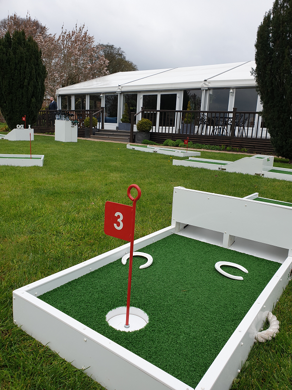 Combermere Abbey - No 3 hole setup outside marquee