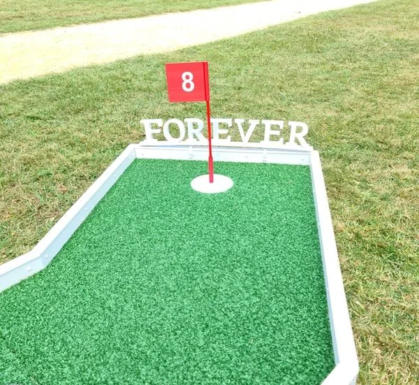 Forever sign placed on crazy golf course on a wedding theme