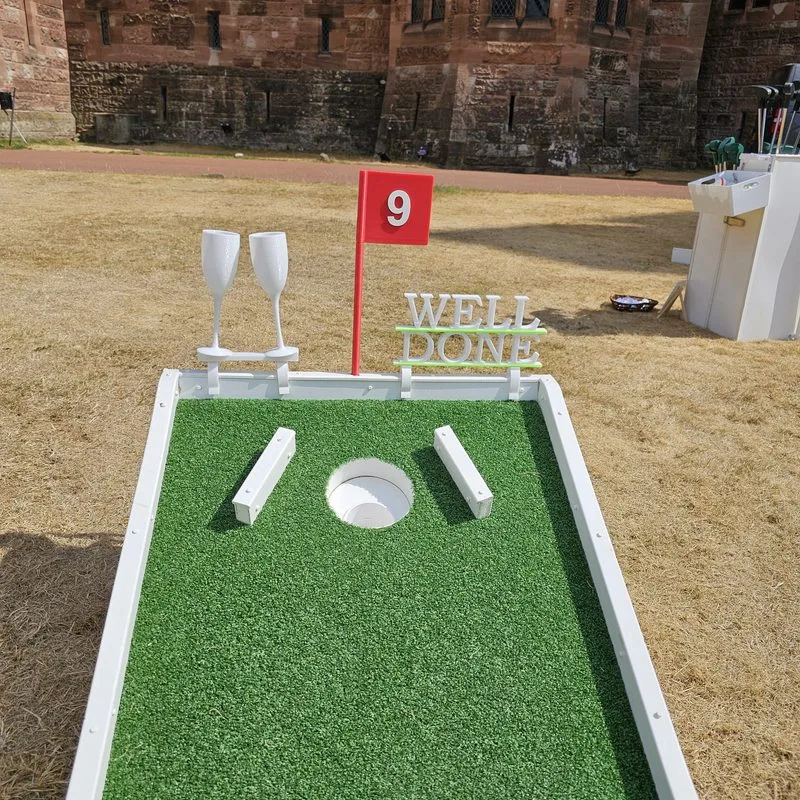 two champagne flutes Chinging together 3d printed on crazy golf course